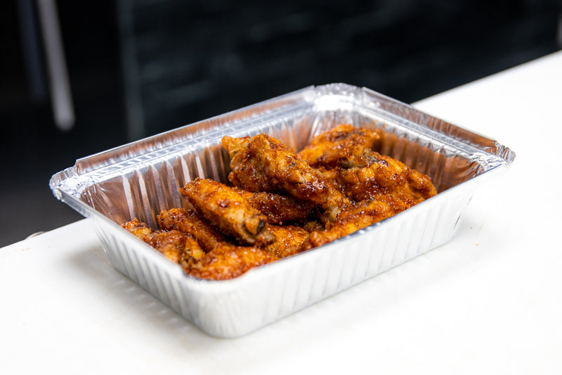 Deep fried chicken wings in Meat Mitch Whomp sauce
